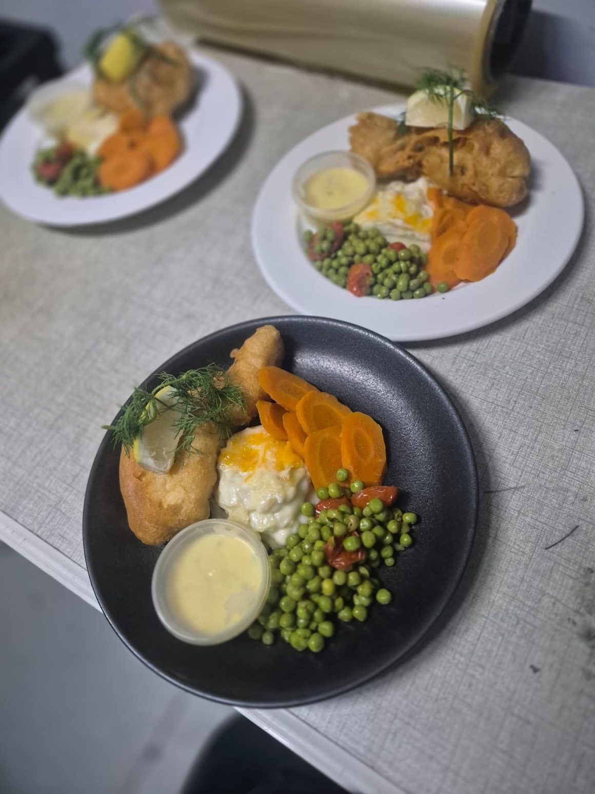Plated mains laid out and ready for event service