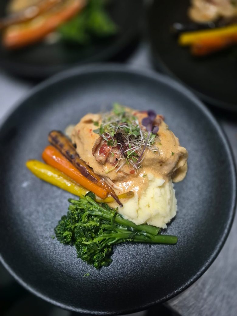Chef-plated main course for a corporate event